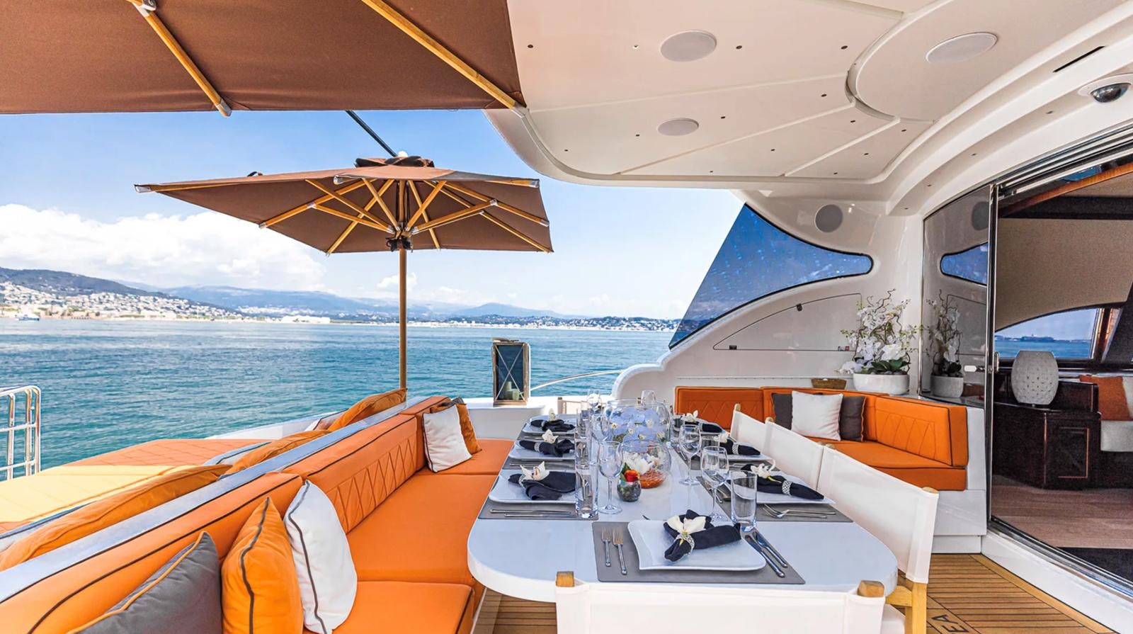 a boat with tables and chairs aboard SVEA Yacht for Sale
