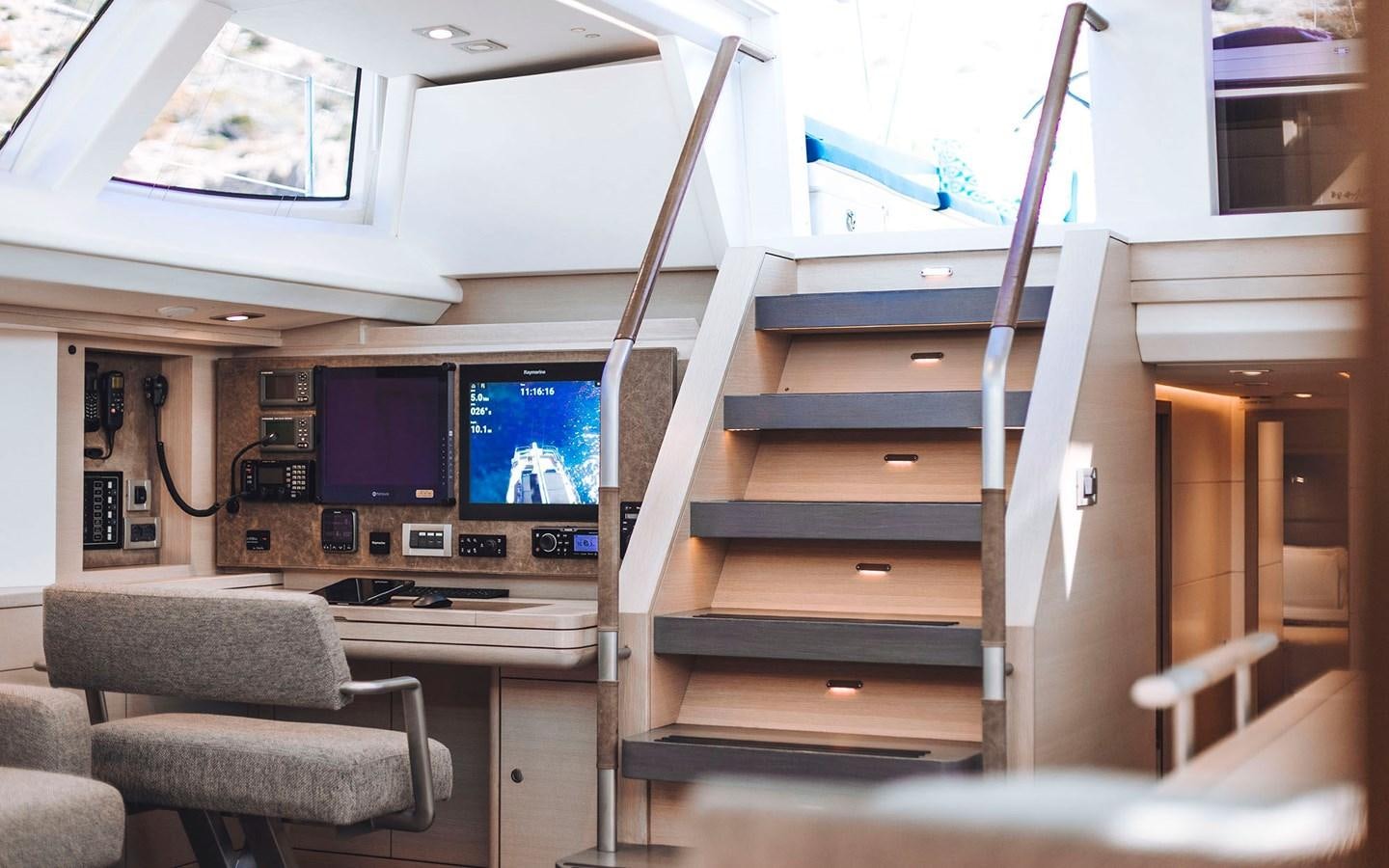 a room with a tv and a couch aboard ENSO Yacht for Sale