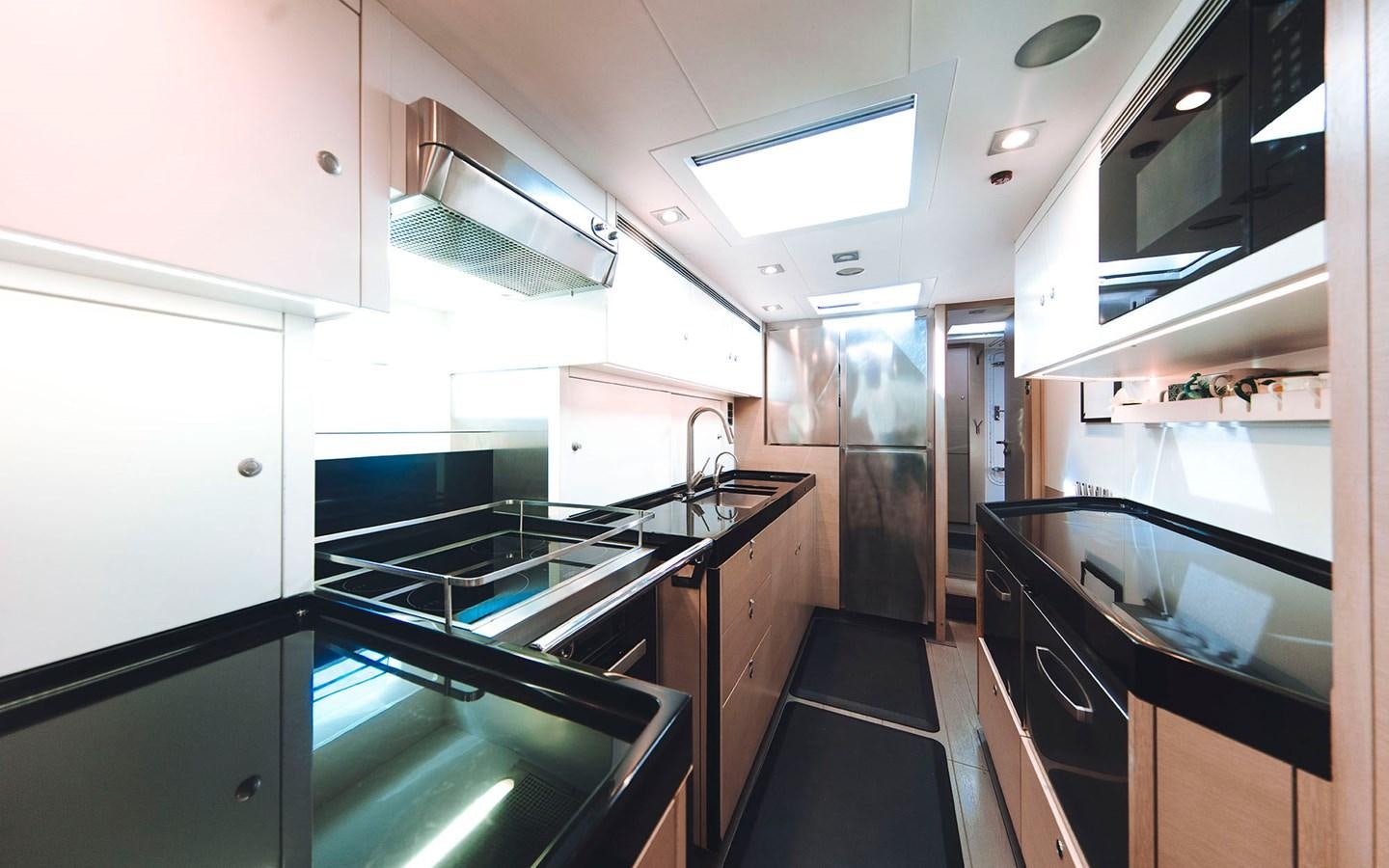 a kitchen with a glass door aboard ENSO Yacht for Sale