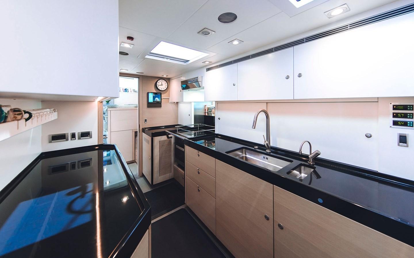 a kitchen with a sink and a stove aboard ENSO Yacht for Sale