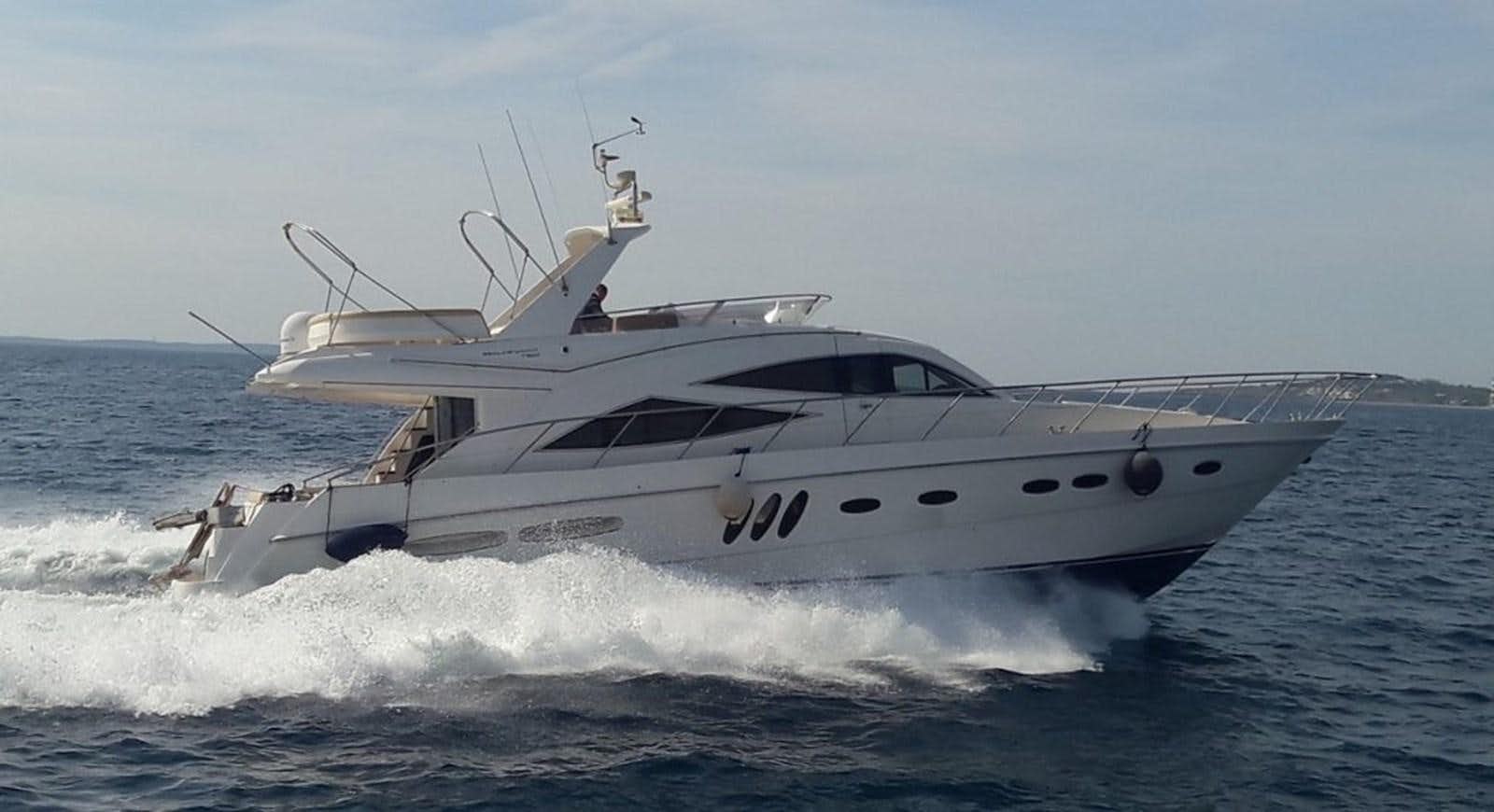 a white yacht on the water aboard SEALINE T60 Yacht for Sale