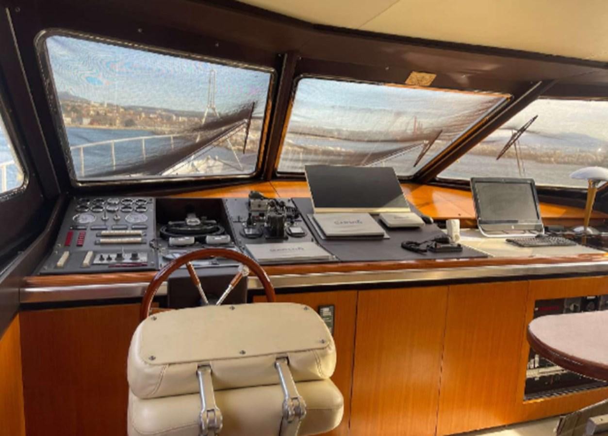 a desk with a laptop and a chair aboard SEA SEVEN Yacht for Sale