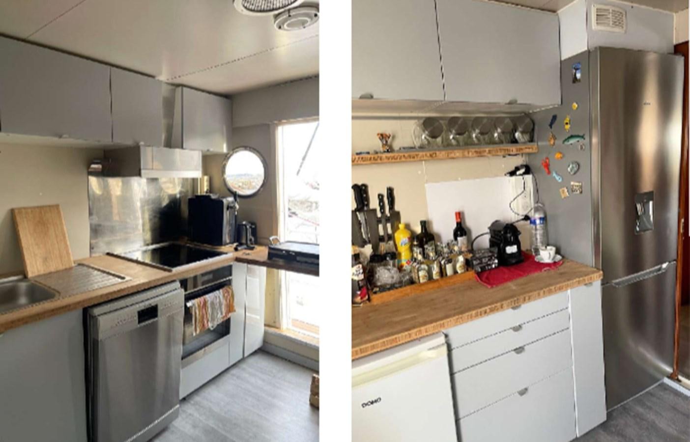 a kitchen with a stainless steel refrigerator aboard SEA SEVEN Yacht for Sale