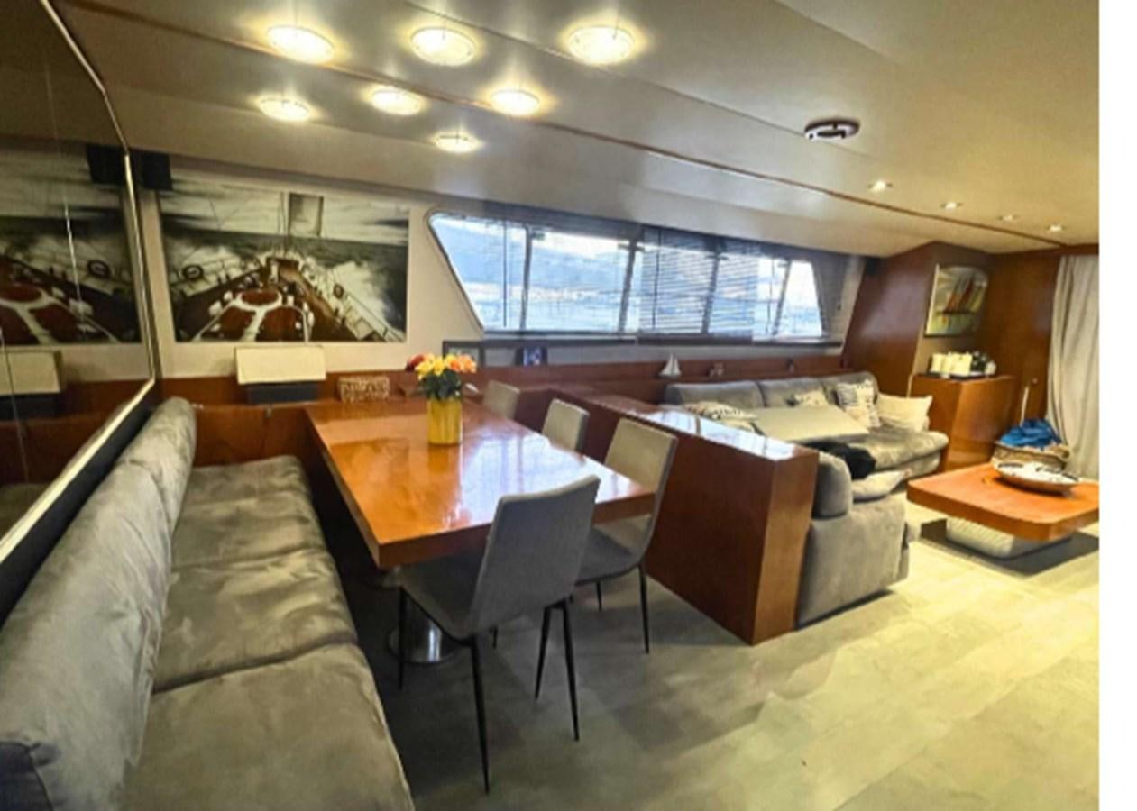 a room with a couch and a table and chairs aboard SEA SEVEN Yacht for Sale