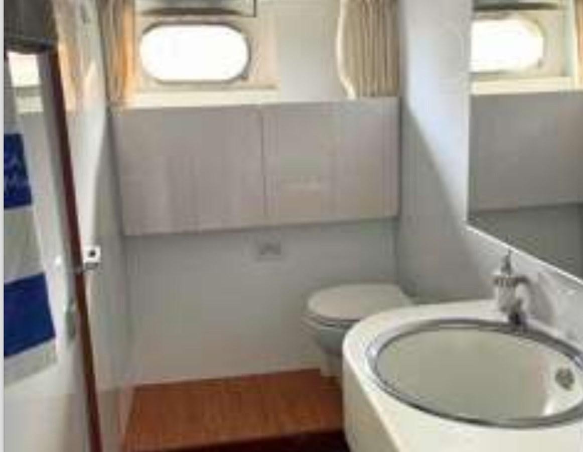 a bathroom with a sink and toilet aboard SEA SEVEN Yacht for Sale