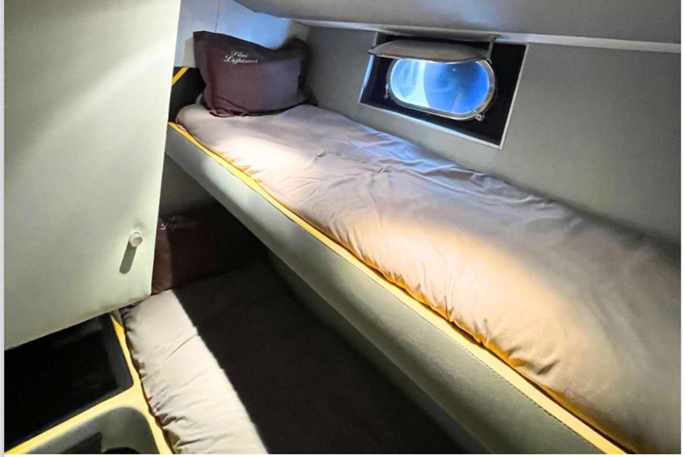 a bed with a television on top aboard SEA SEVEN Yacht for Sale