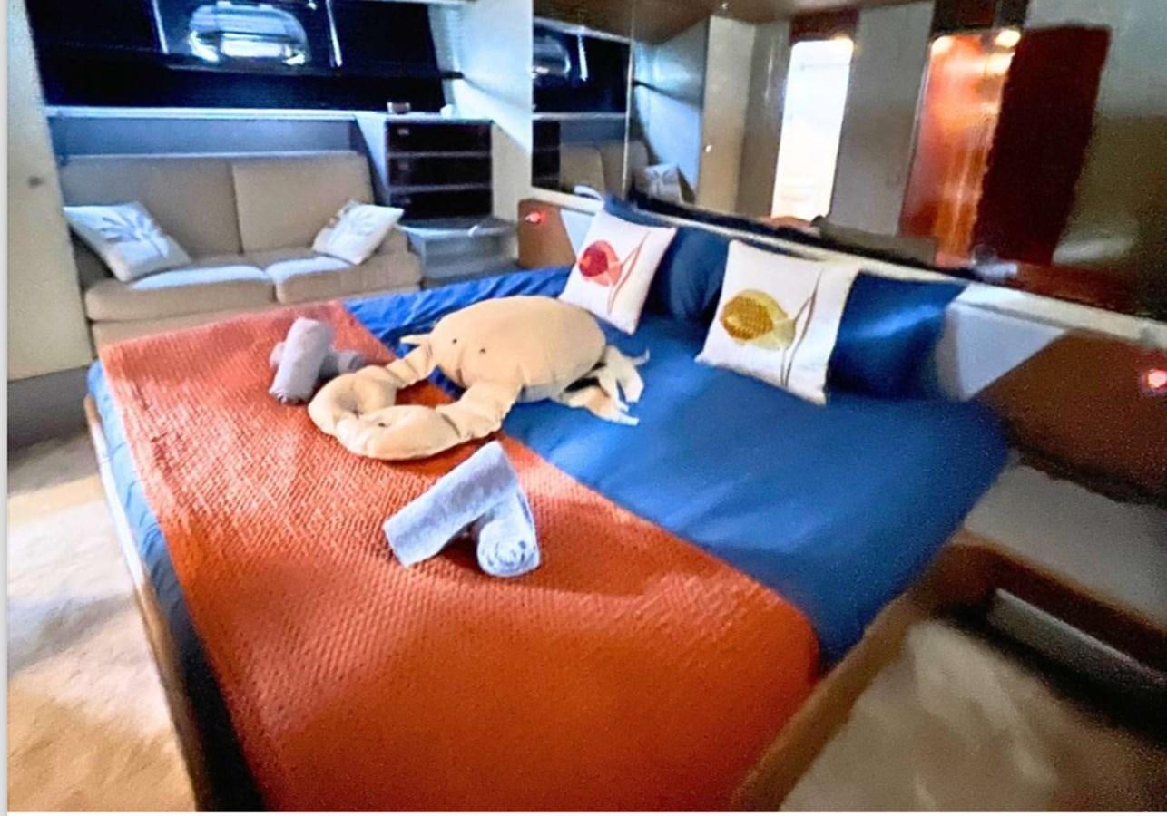 a person lying on a bed aboard SEA SEVEN Yacht for Sale