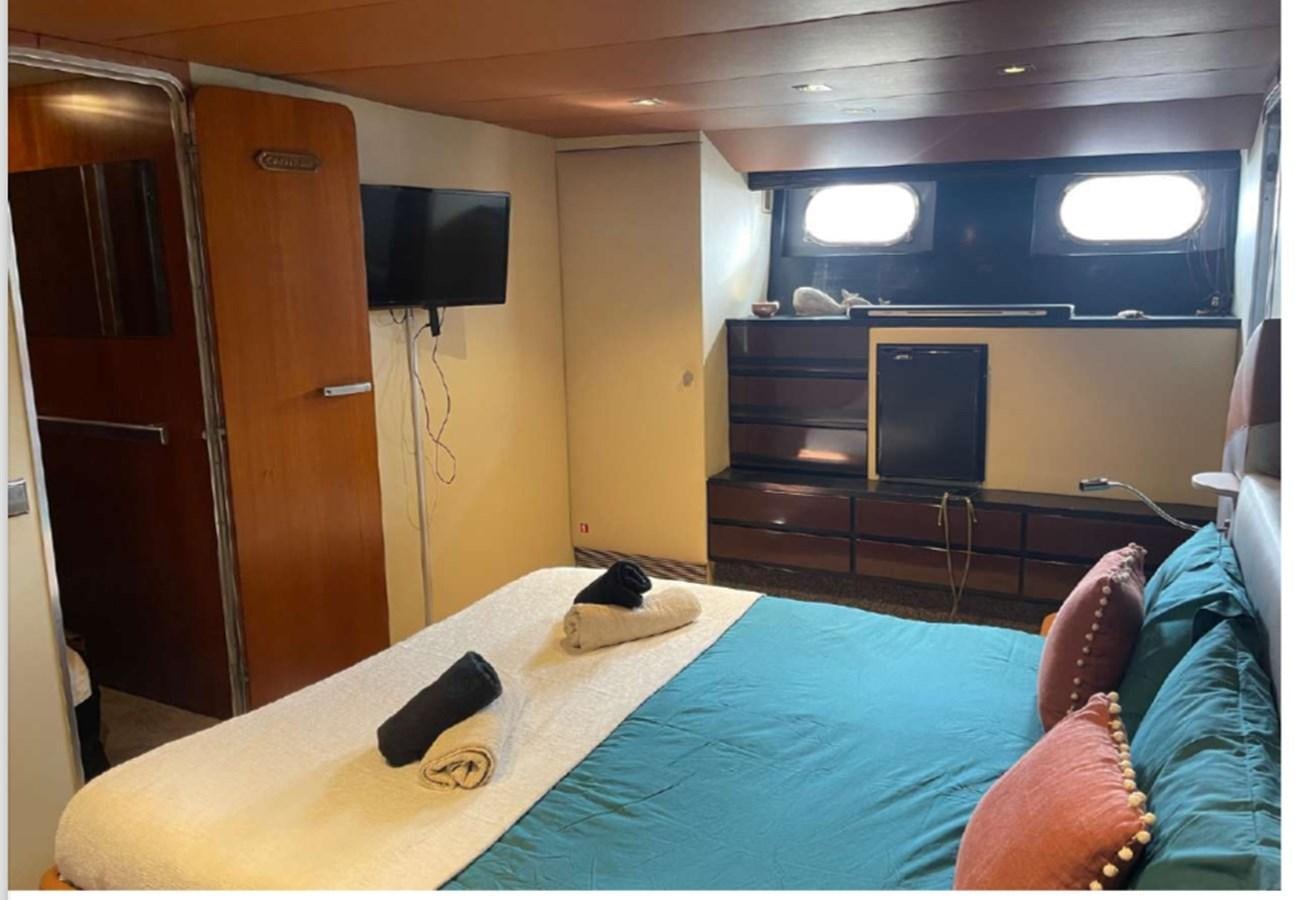 a bed with a laptop on it aboard SEA SEVEN Yacht for Sale