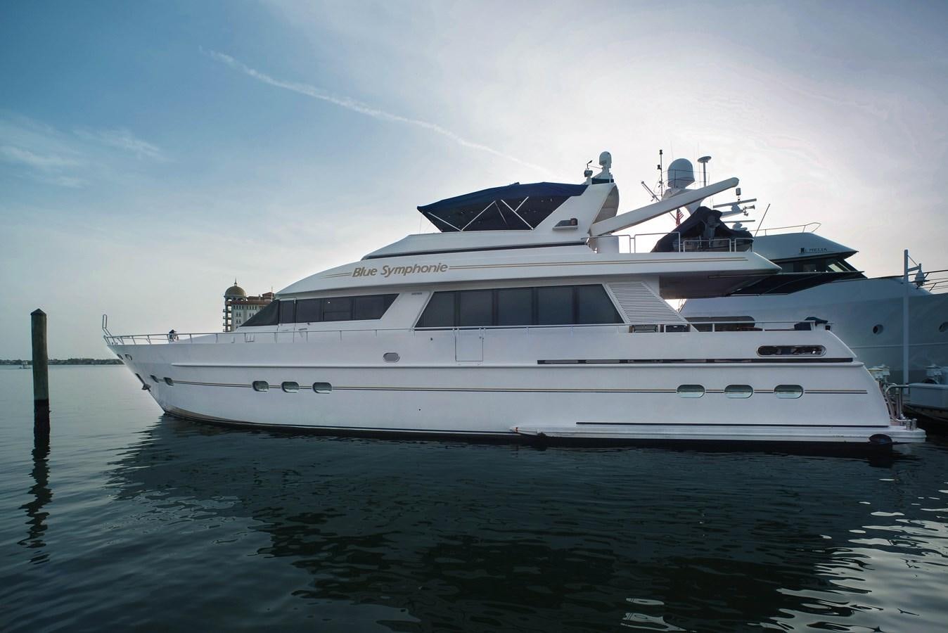 a white yacht on the water aboard BLUE SYMPHONIE Yacht for Sale