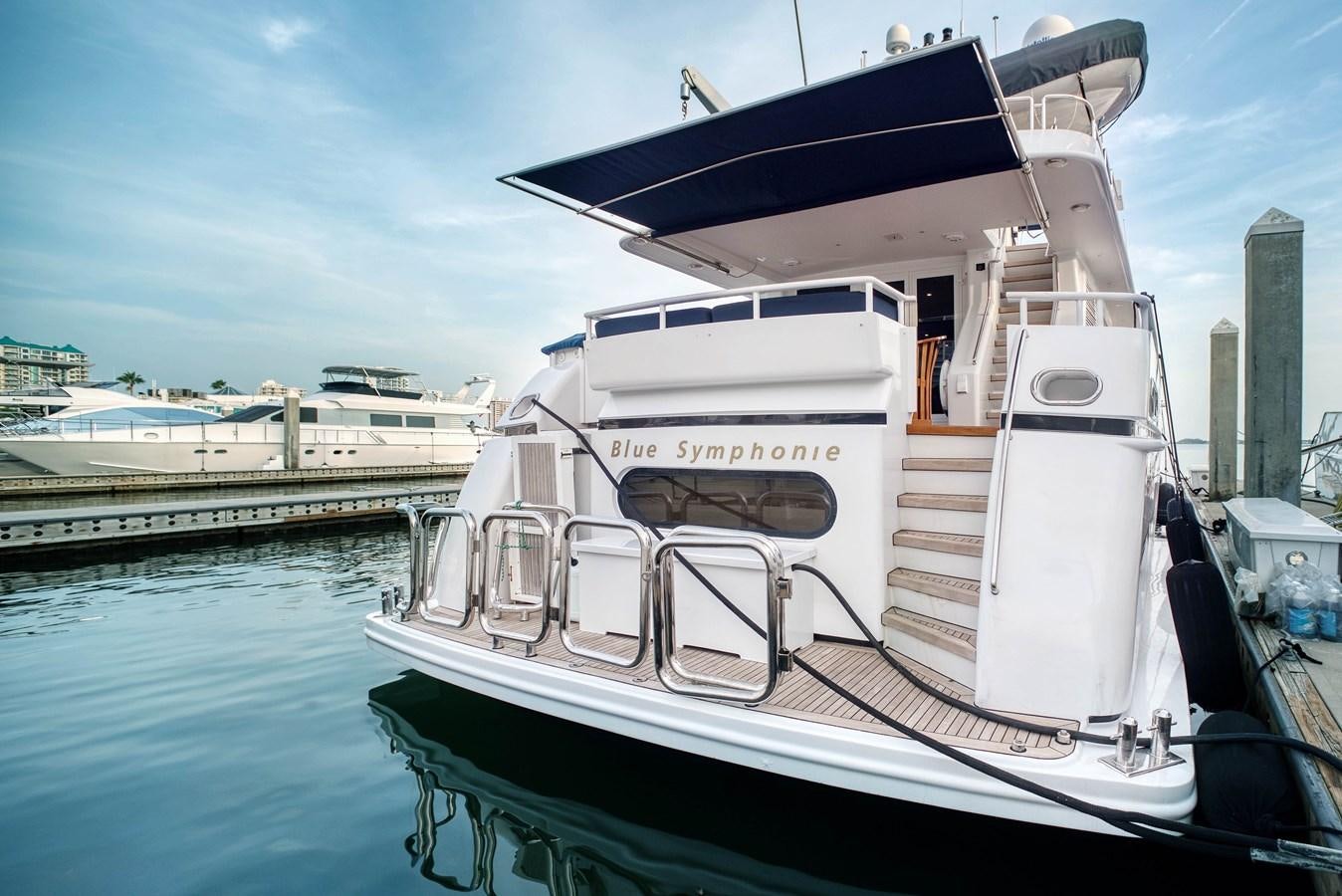 a boat docked at a pier aboard BLUE SYMPHONIE Yacht for Sale