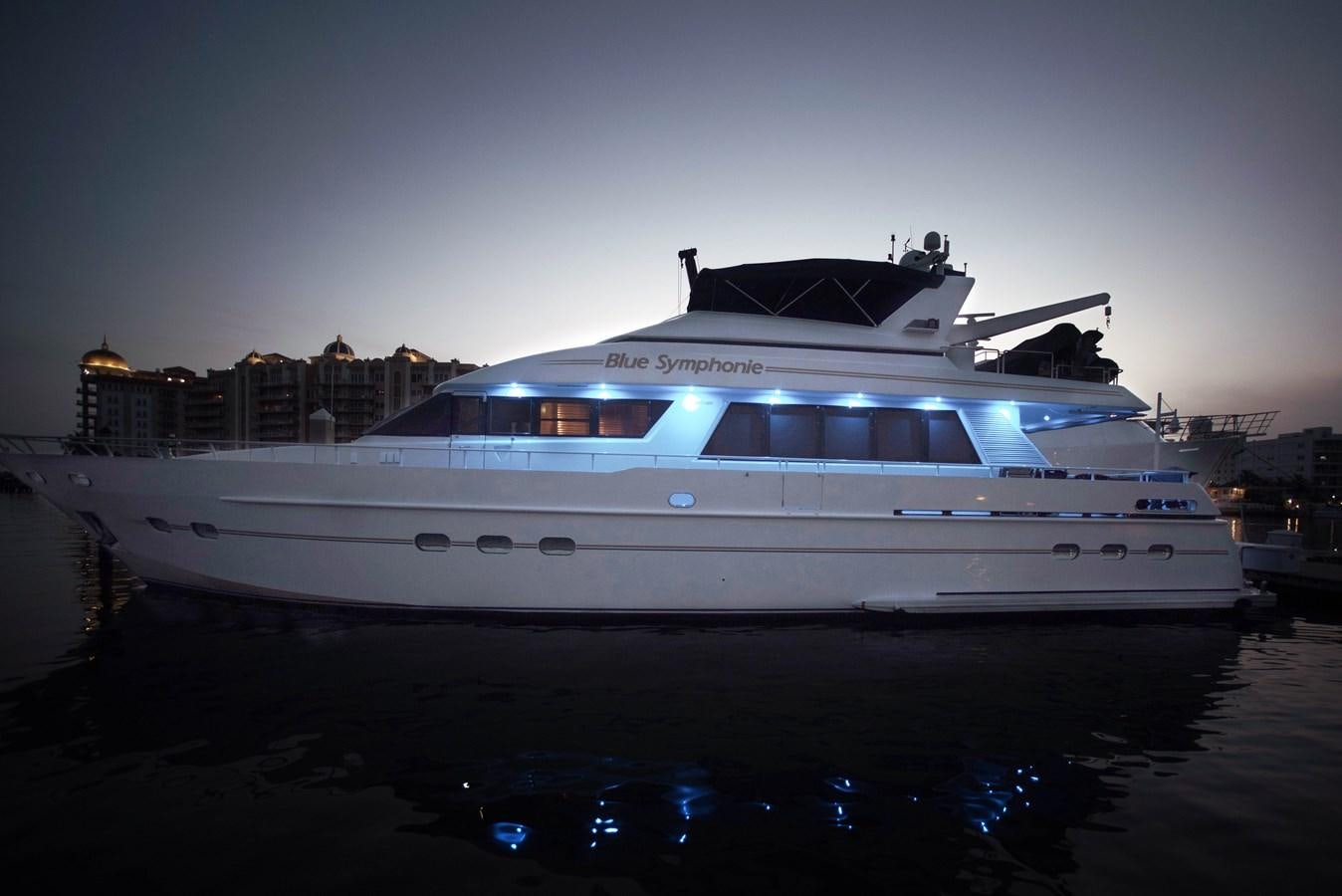 a white yacht on the water aboard BLUE SYMPHONIE Yacht for Sale