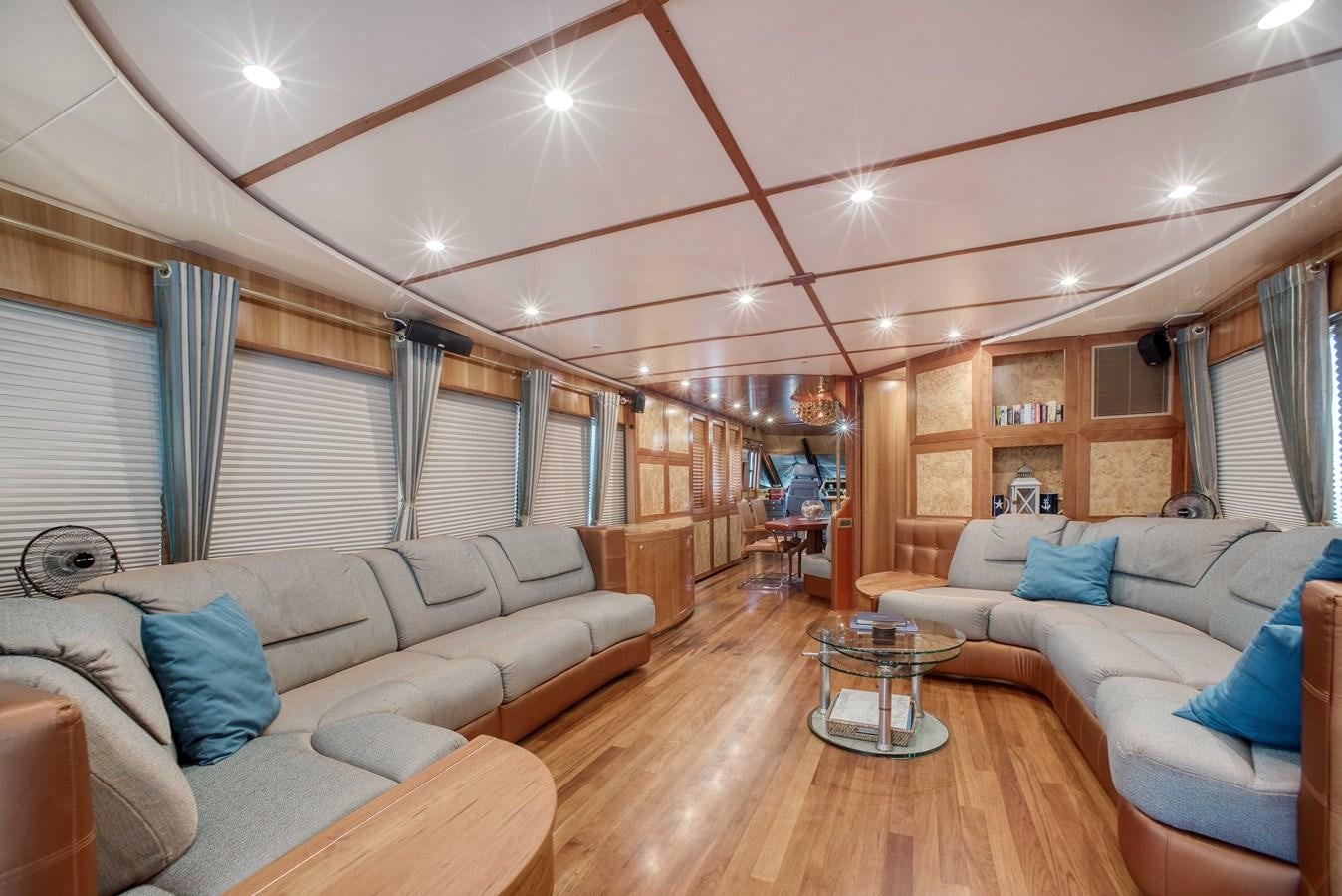 a living room with a couch and a table aboard BLUE SYMPHONIE Yacht for Sale