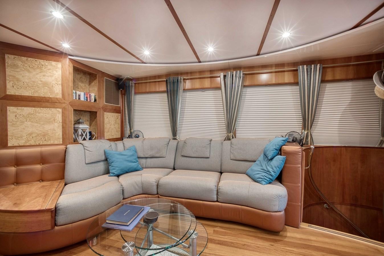 a living room with a couch and a table aboard BLUE SYMPHONIE Yacht for Sale