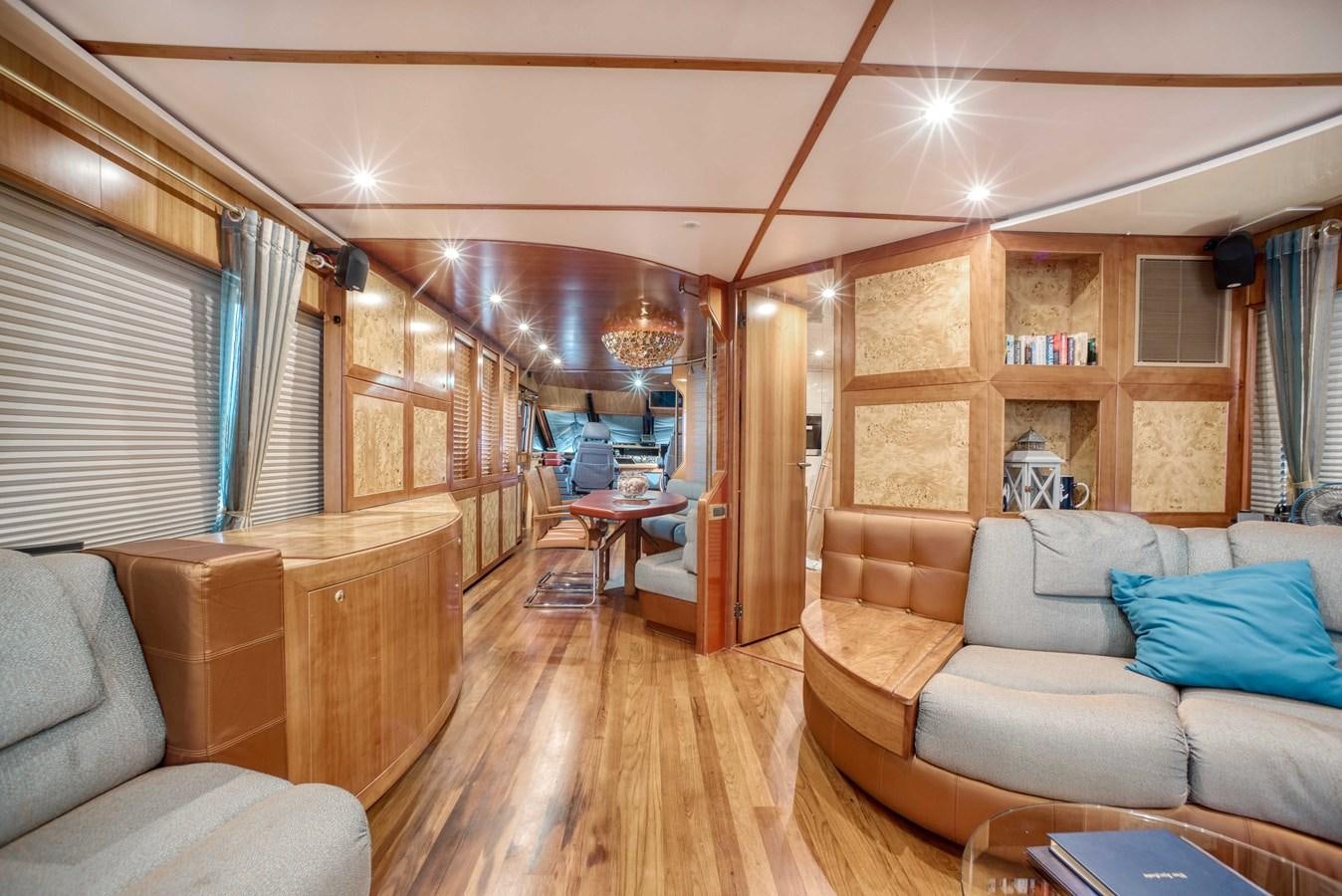 a living room with a wood floor aboard BLUE SYMPHONIE Yacht for Sale