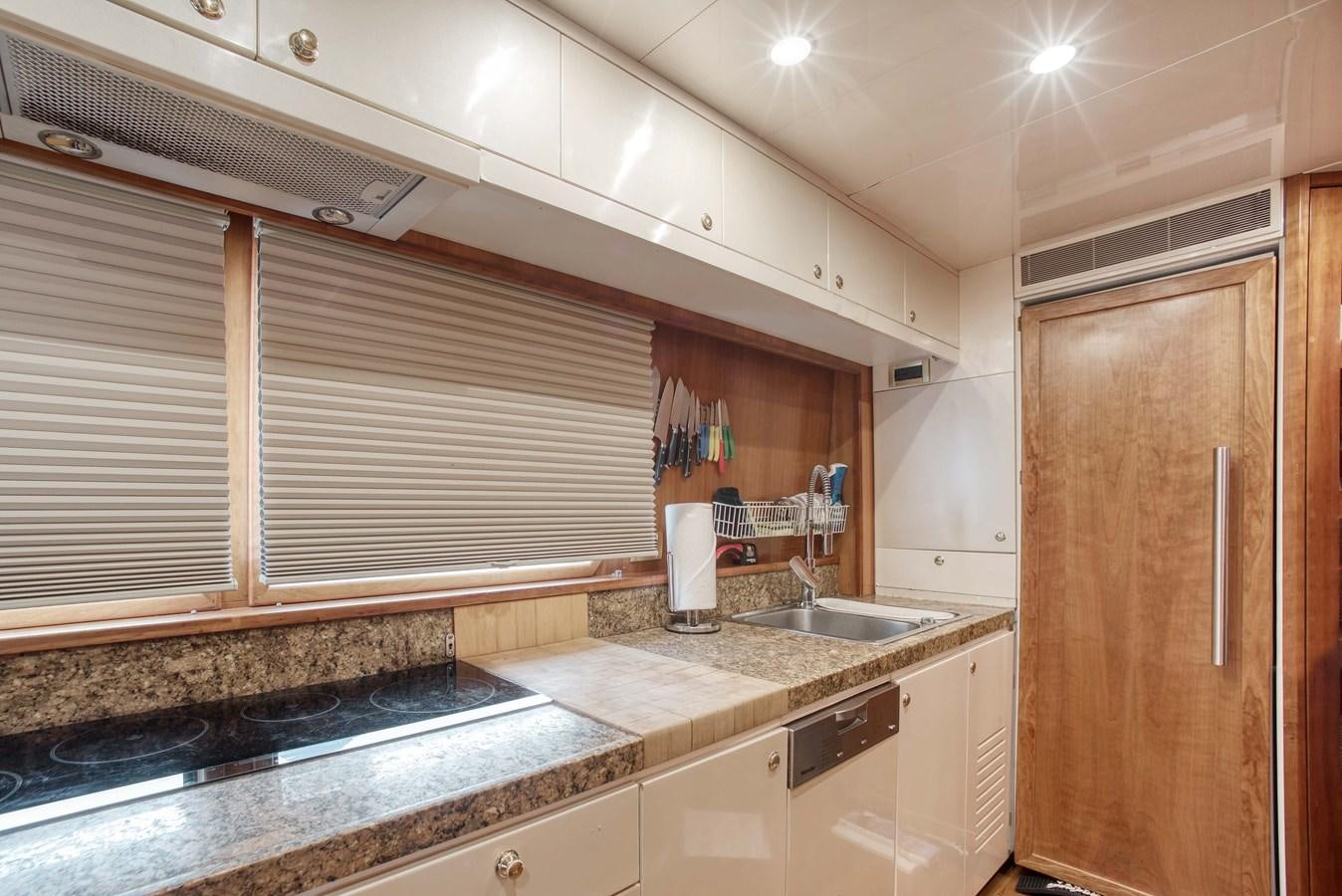 a kitchen with a sink and cabinets aboard BLUE SYMPHONIE Yacht for Sale
