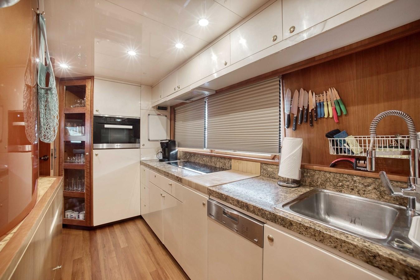 a kitchen with a sink and cabinets aboard BLUE SYMPHONIE Yacht for Sale