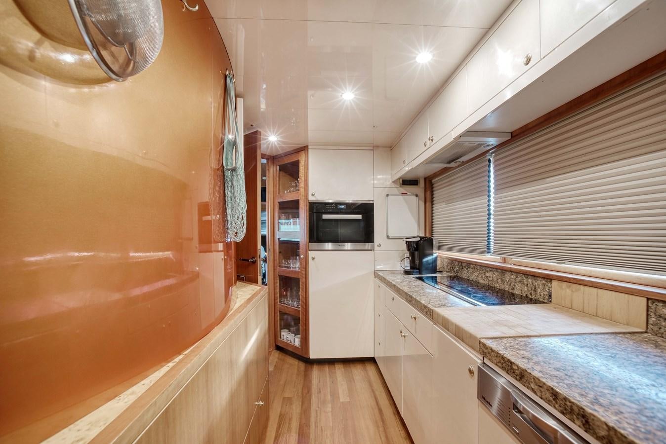 a kitchen with a microwave oven and cabinets aboard BLUE SYMPHONIE Yacht for Sale