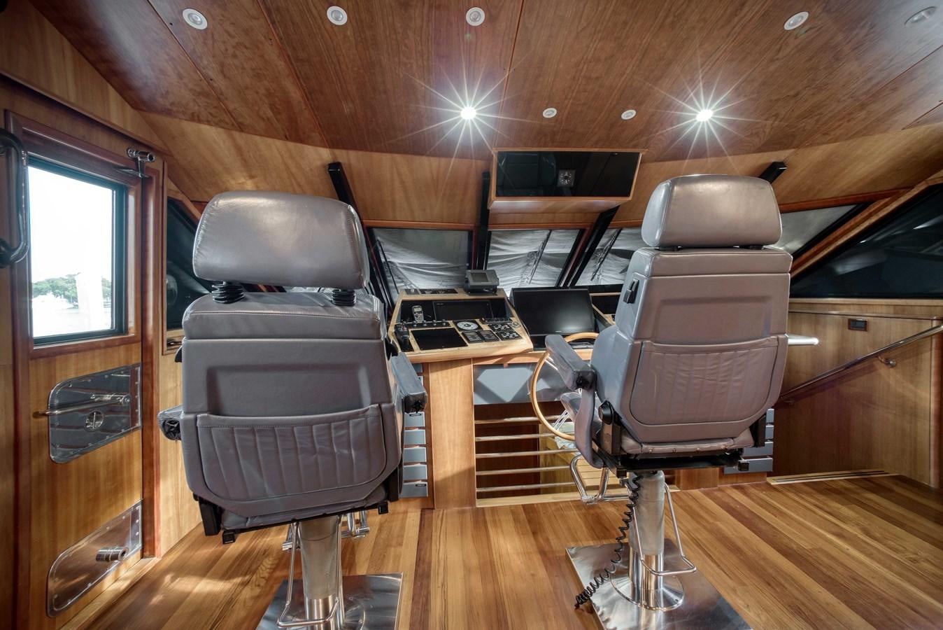 a room with chairs and a desk aboard BLUE SYMPHONIE Yacht for Sale