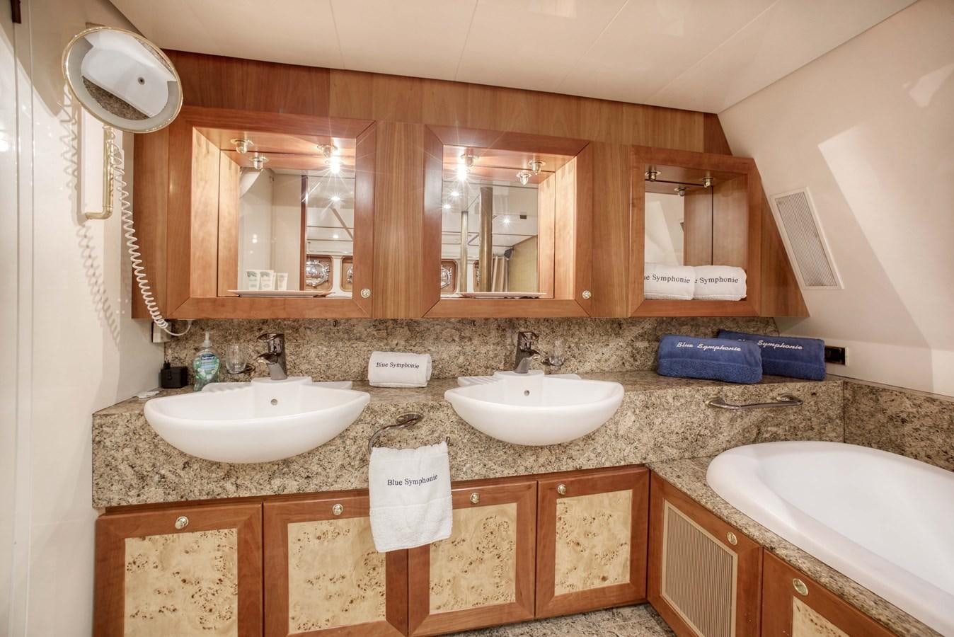 a bathroom with two sinks aboard BLUE SYMPHONIE Yacht for Sale