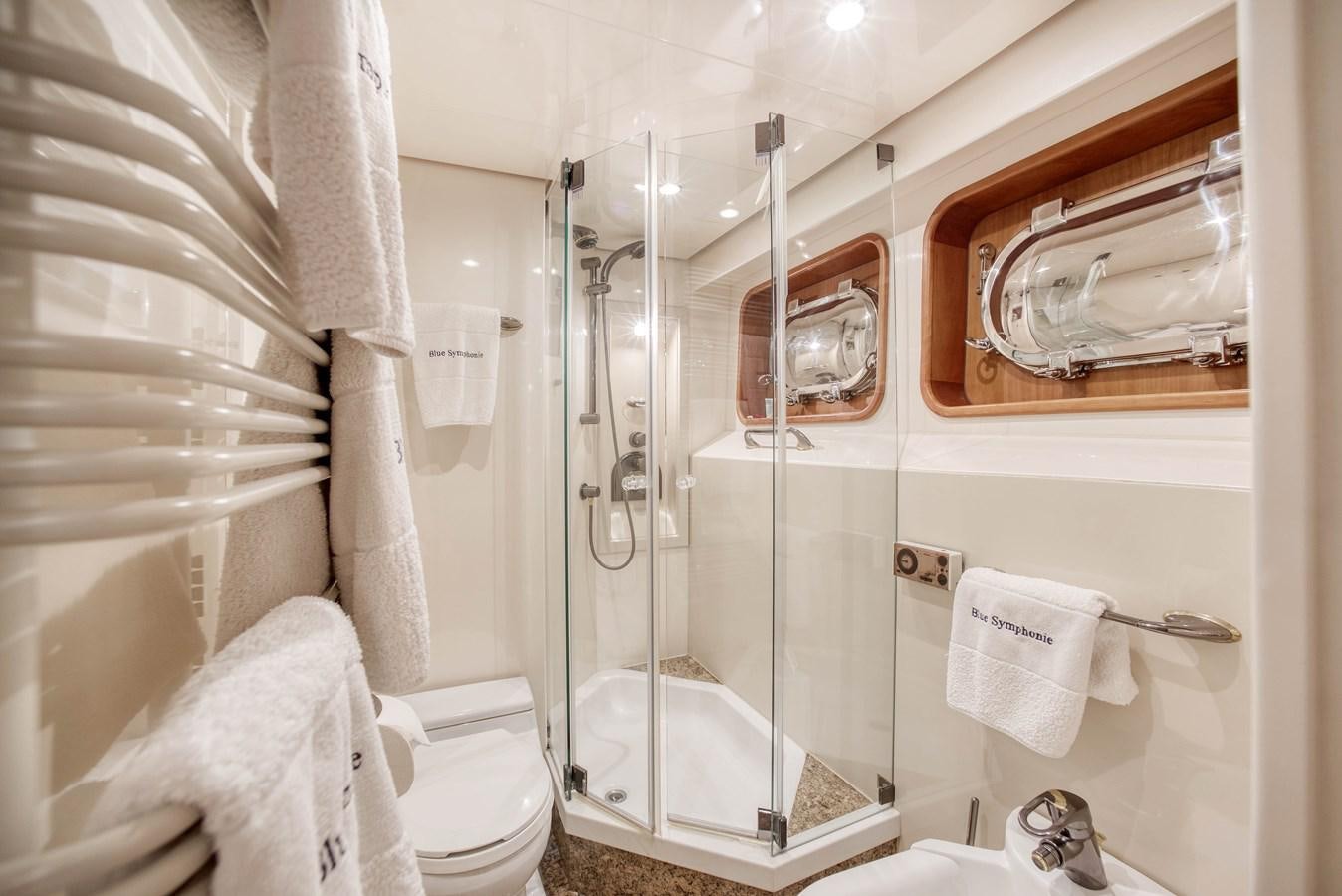 a bathroom with a glass shower aboard BLUE SYMPHONIE Yacht for Sale