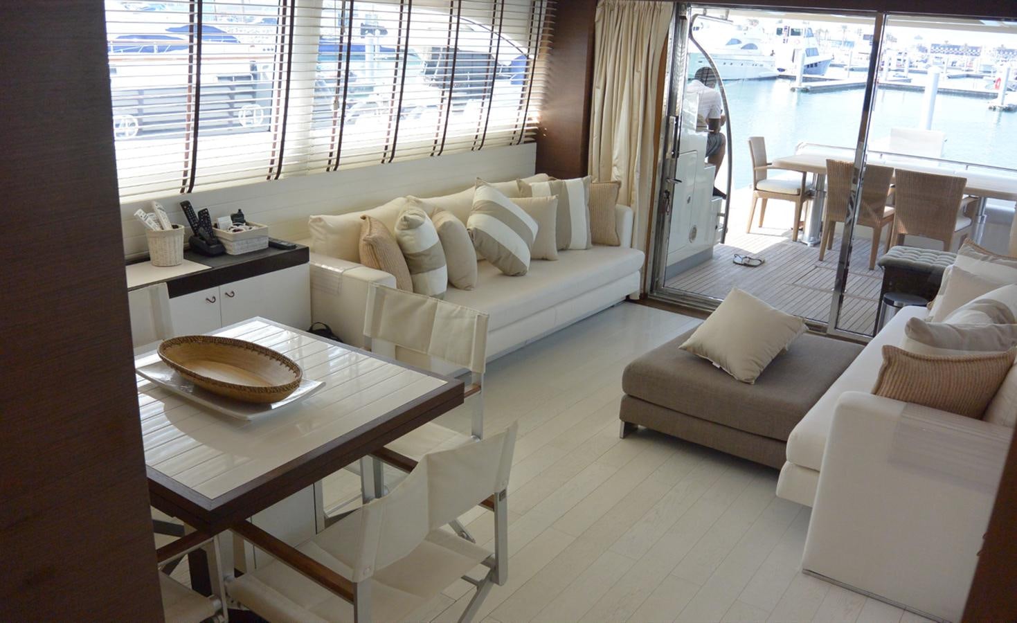 a room with a couch and a table and a bed aboard 2008 CANADOS 76 Yacht for Sale