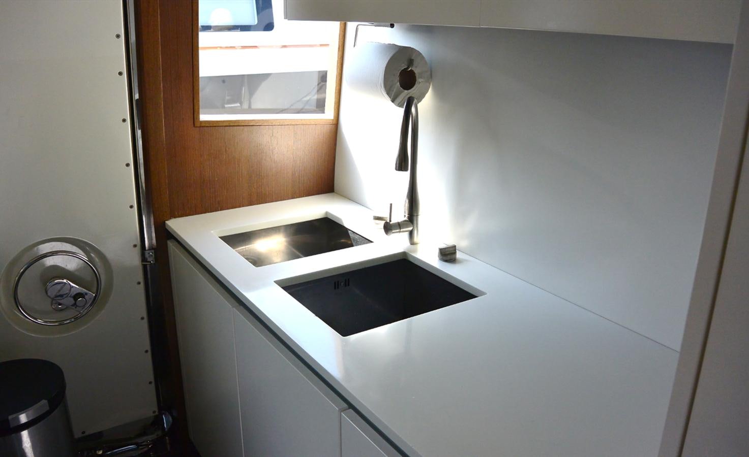 a sink and a mirror in a room aboard 2008 CANADOS 76 Yacht for Sale