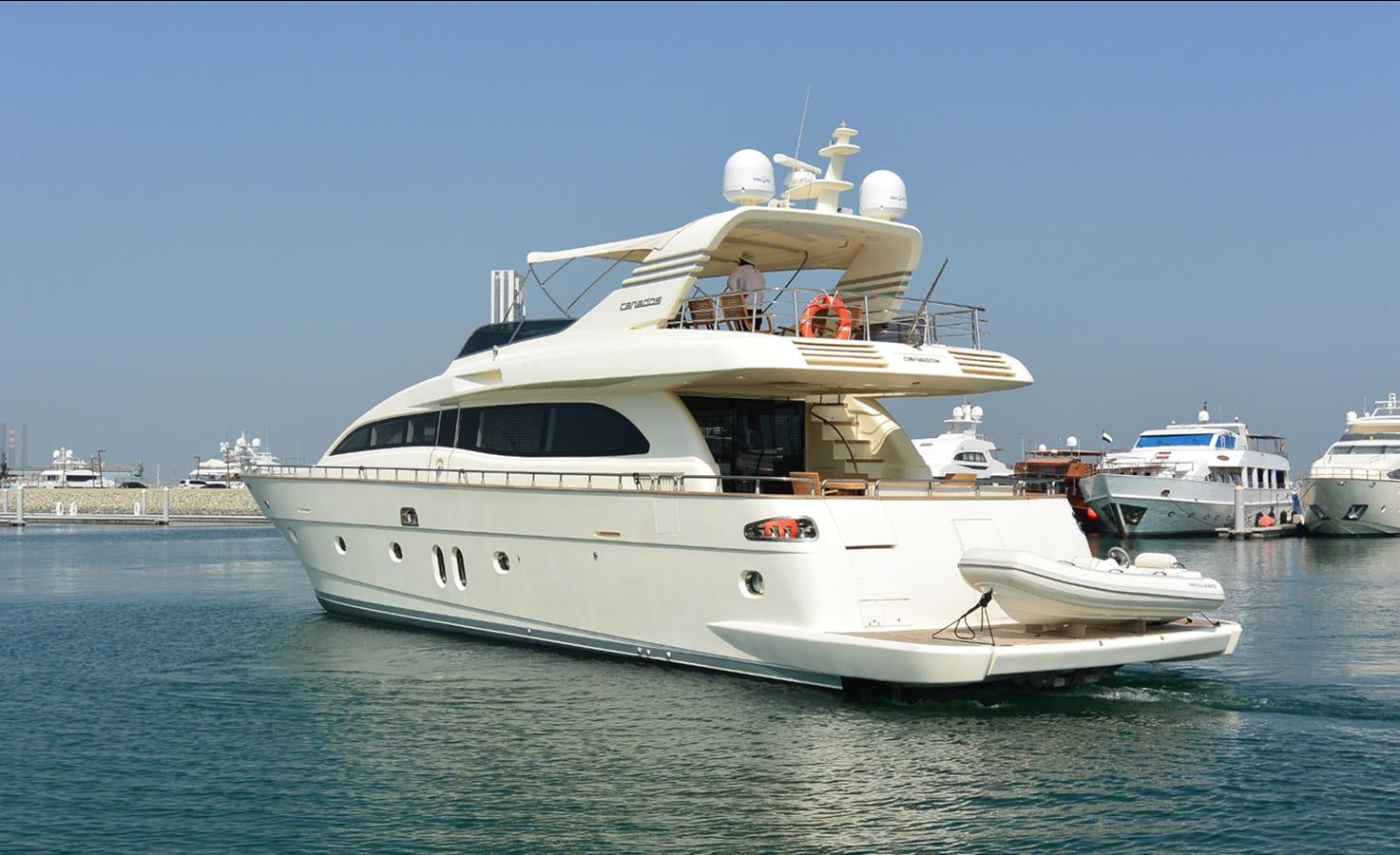 a white yacht in the water aboard 2008 CANADOS 76 Yacht for Sale