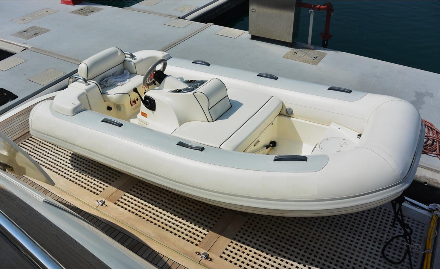 a white yacht on a deck aboard 2008 CANADOS 76 Yacht for Sale