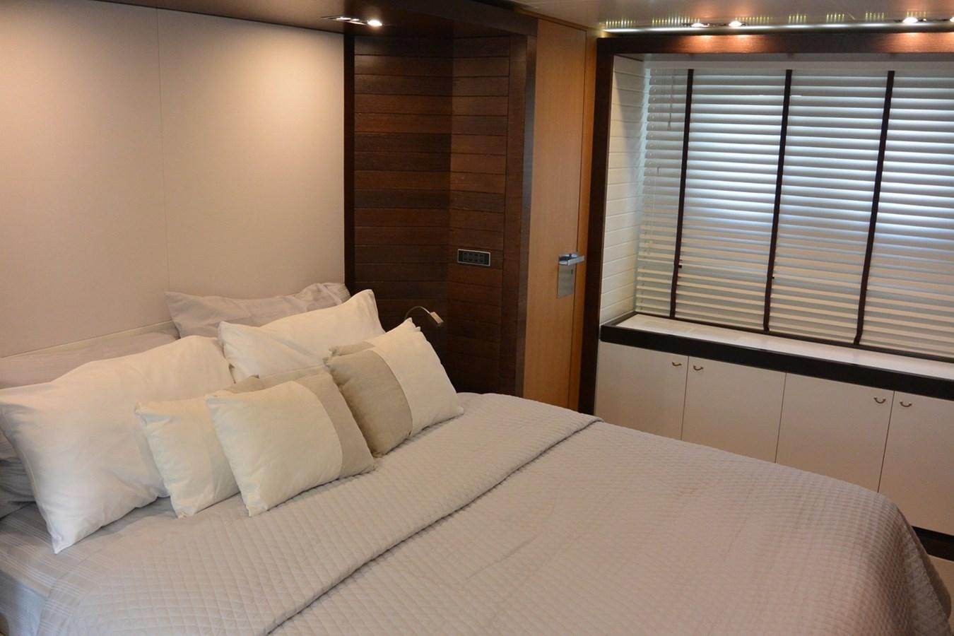 a bed with white sheets aboard 2008 CANADOS 76 Yacht for Sale