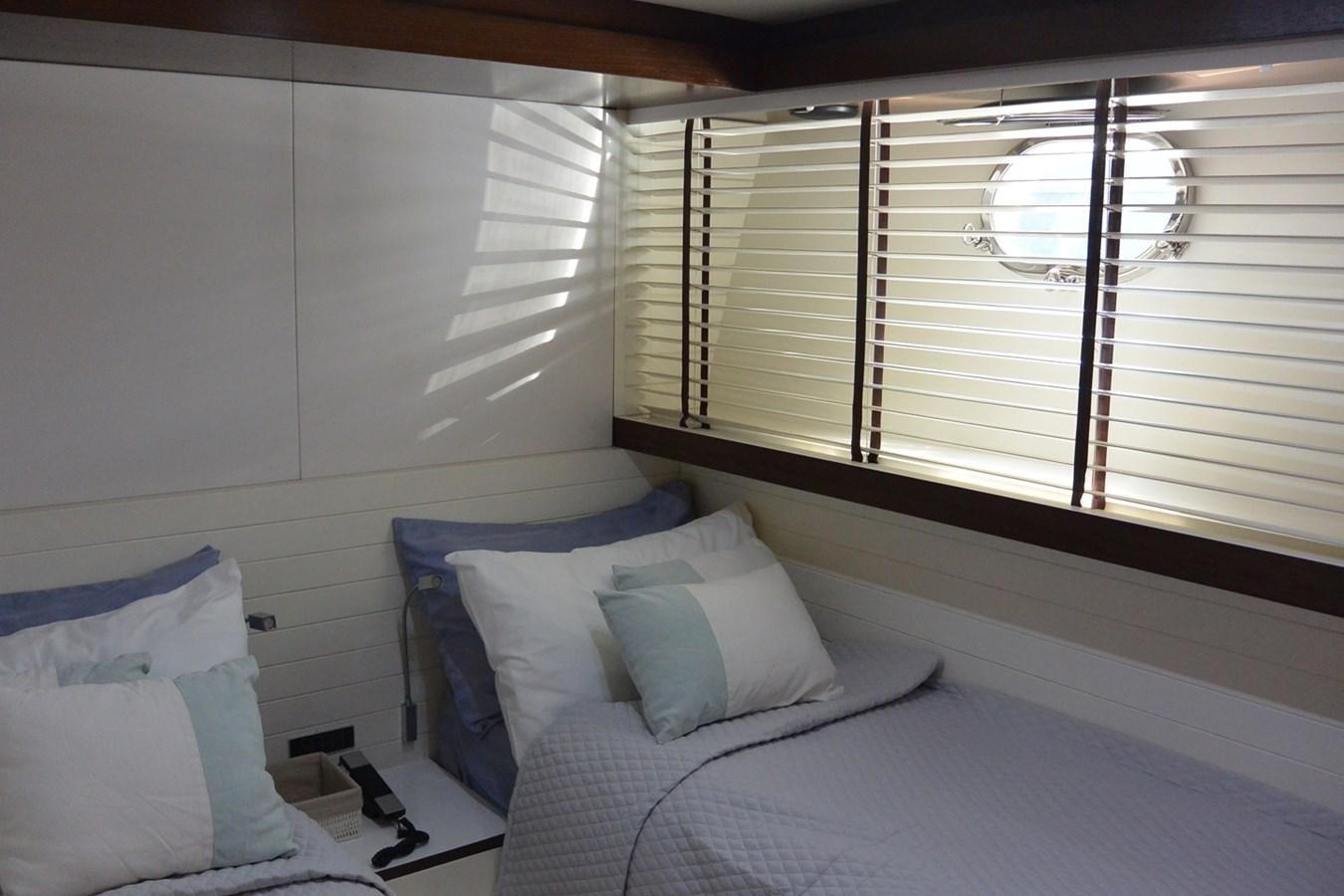 a bed with a white pillow aboard 2008 CANADOS 76 Yacht for Sale