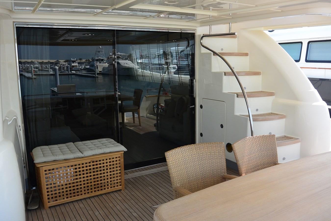 a room with a table and chairs aboard 2008 CANADOS 76 Yacht for Sale