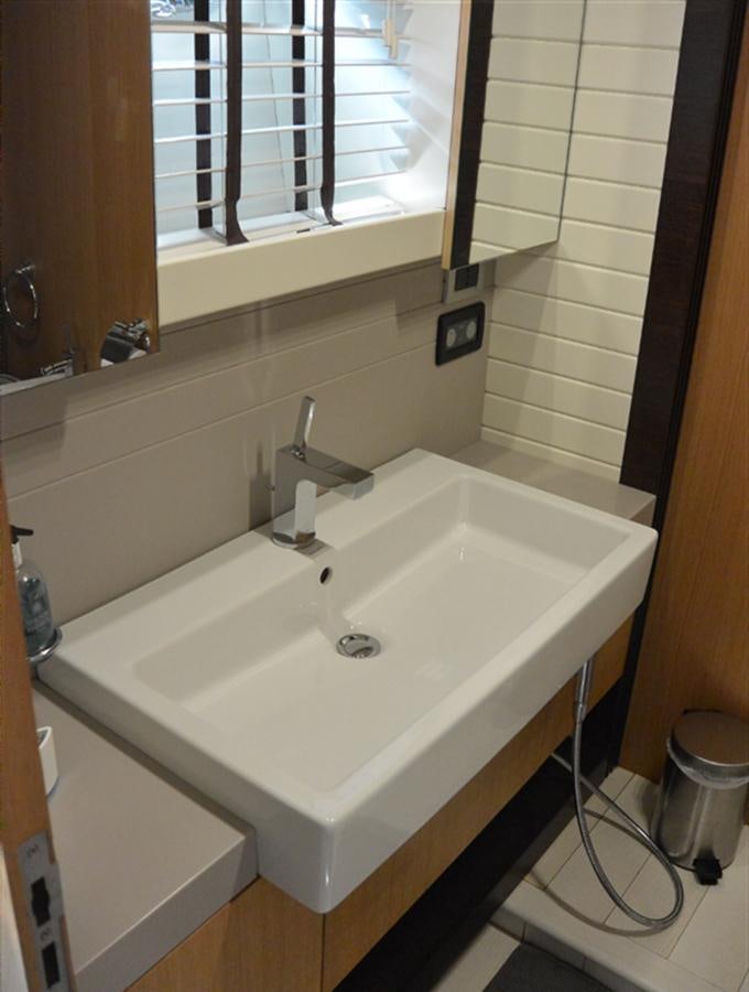 a sink in a bathroom aboard 2008 CANADOS 76 Yacht for Sale