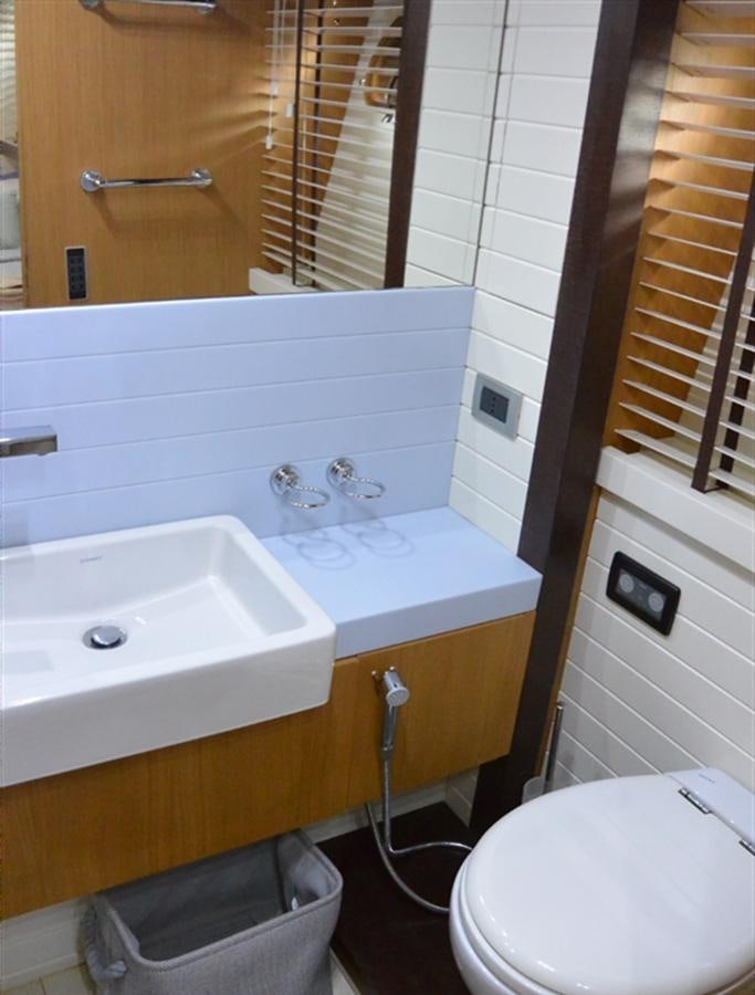 a bathroom with a sink and a toilet aboard 2008 CANADOS 76 Yacht for Sale