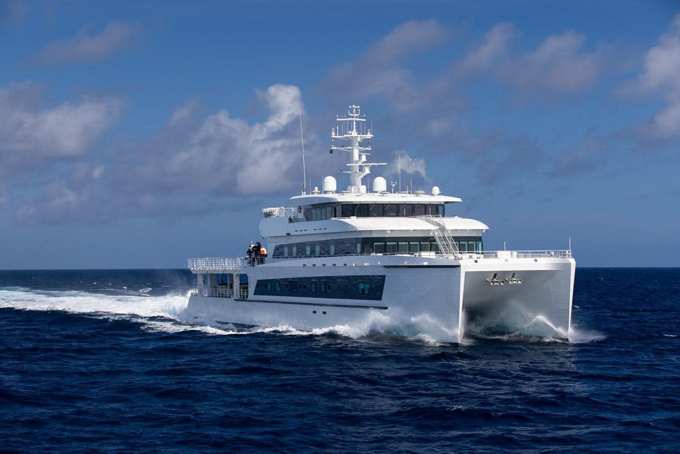 a white boat on the water aboard WAYFINDER (SUPPORT VESSEL) Yacht for Sale