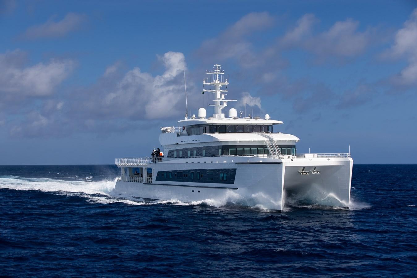 a white boat on the water aboard WAYFINDER Yacht for Sale