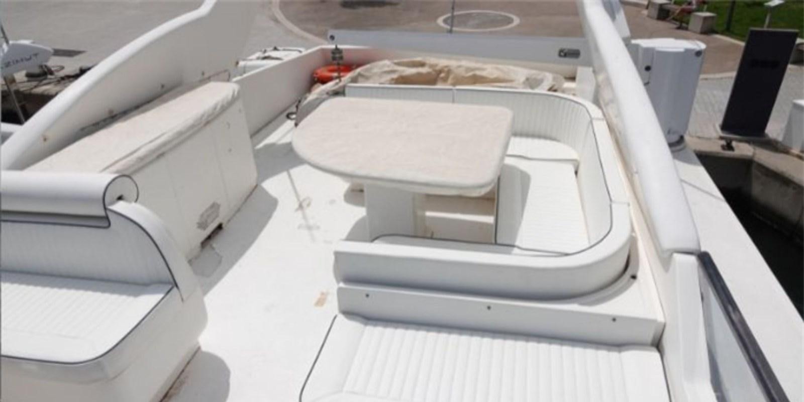 a white car with a grill aboard DAN SHOW Yacht for Sale