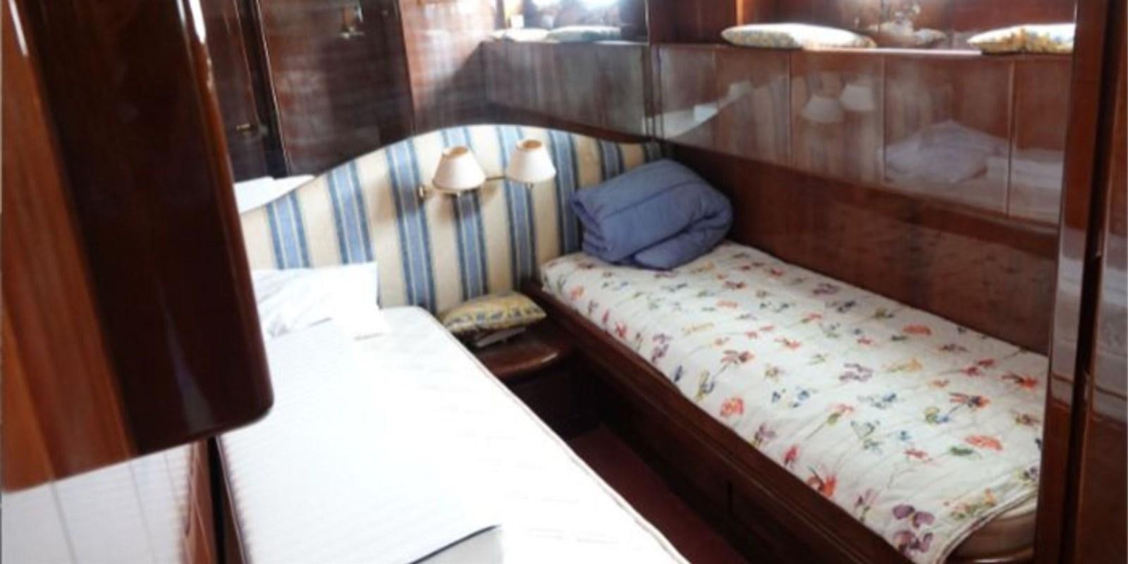 a room with two beds aboard DAN SHOW Yacht for Sale
