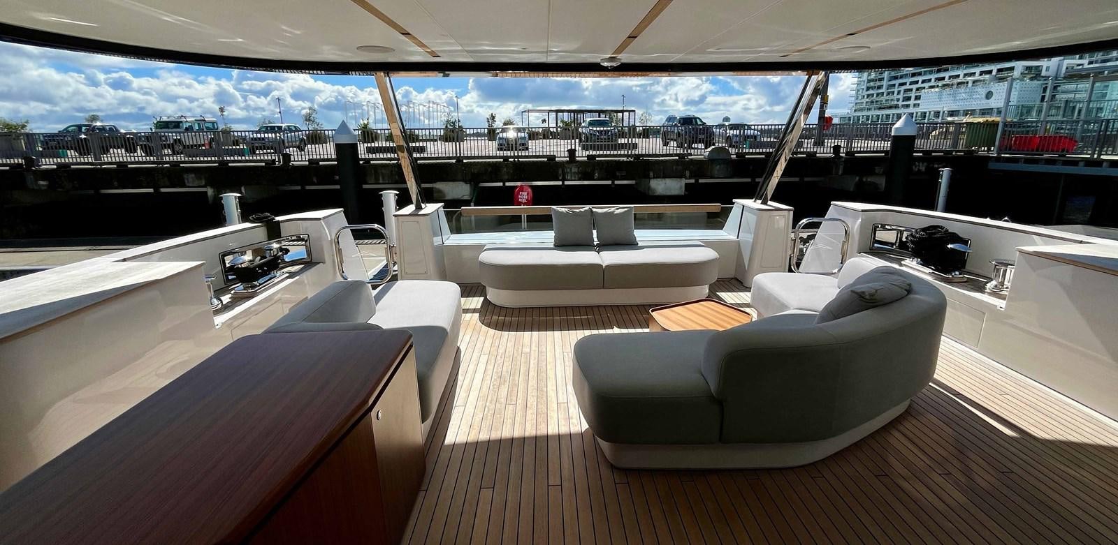 a room with a couch and a table aboard DB Yacht for Sale