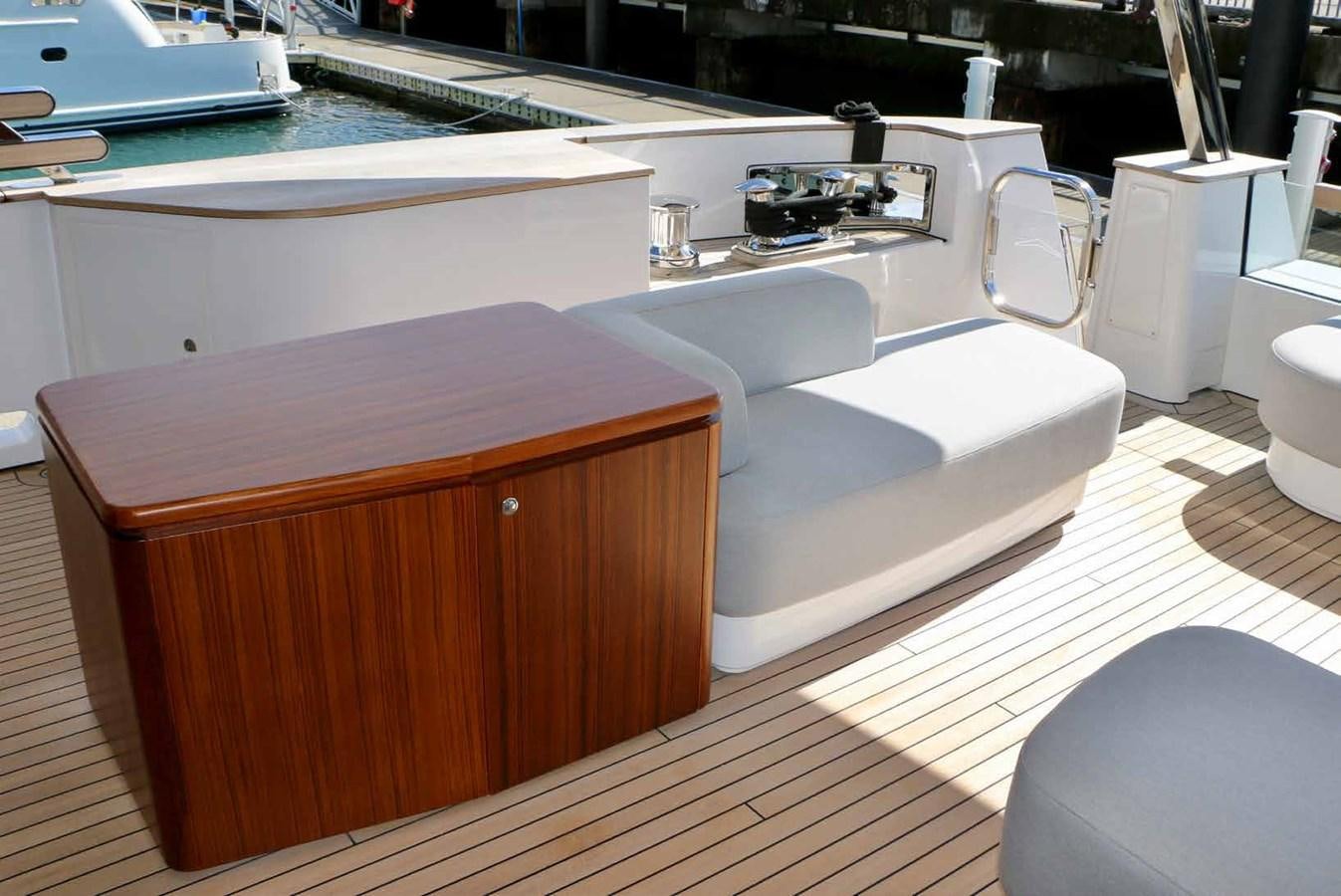 a kitchen with a sink and a couch aboard DB Yacht for Sale