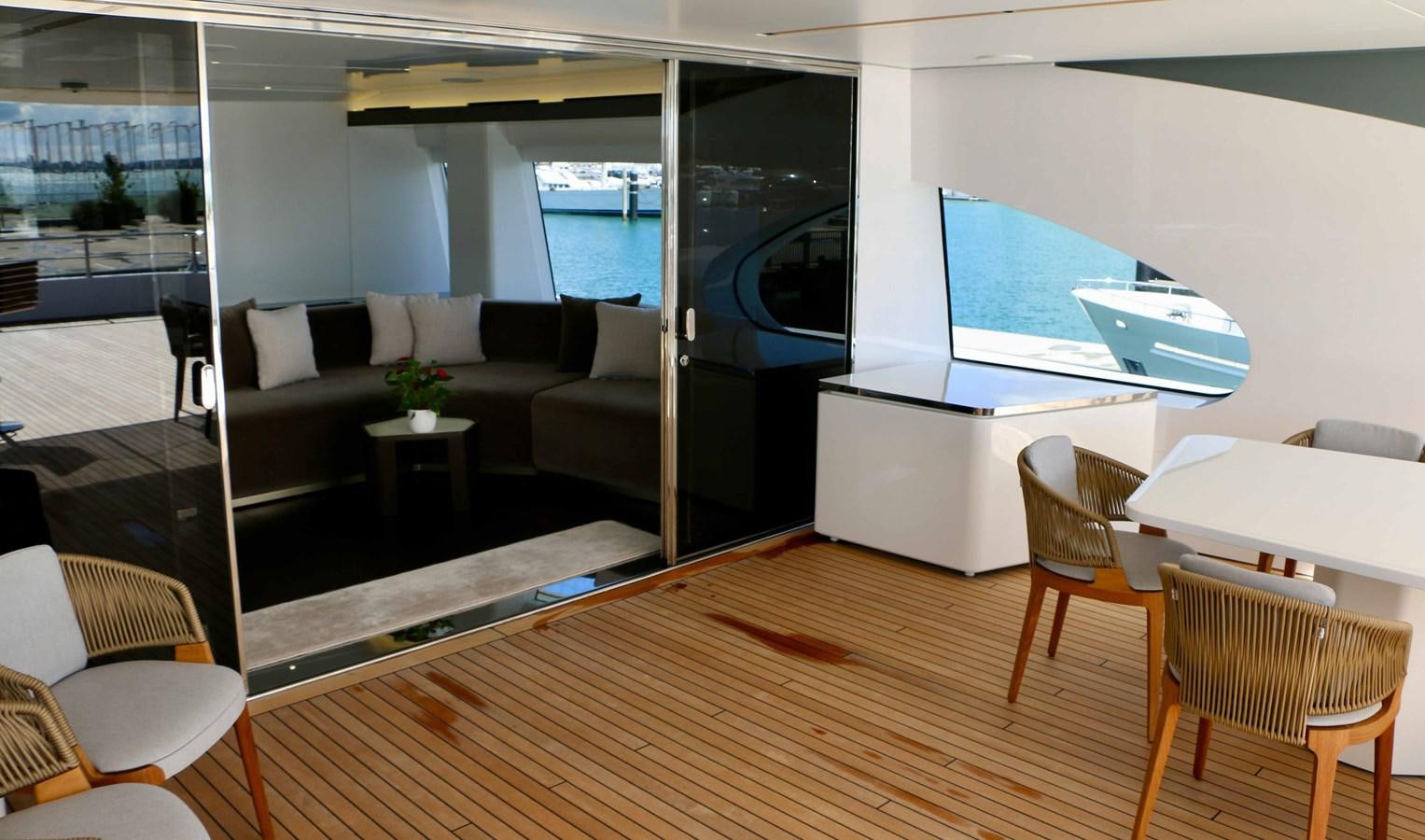 a living room with a large window aboard DB Yacht for Sale