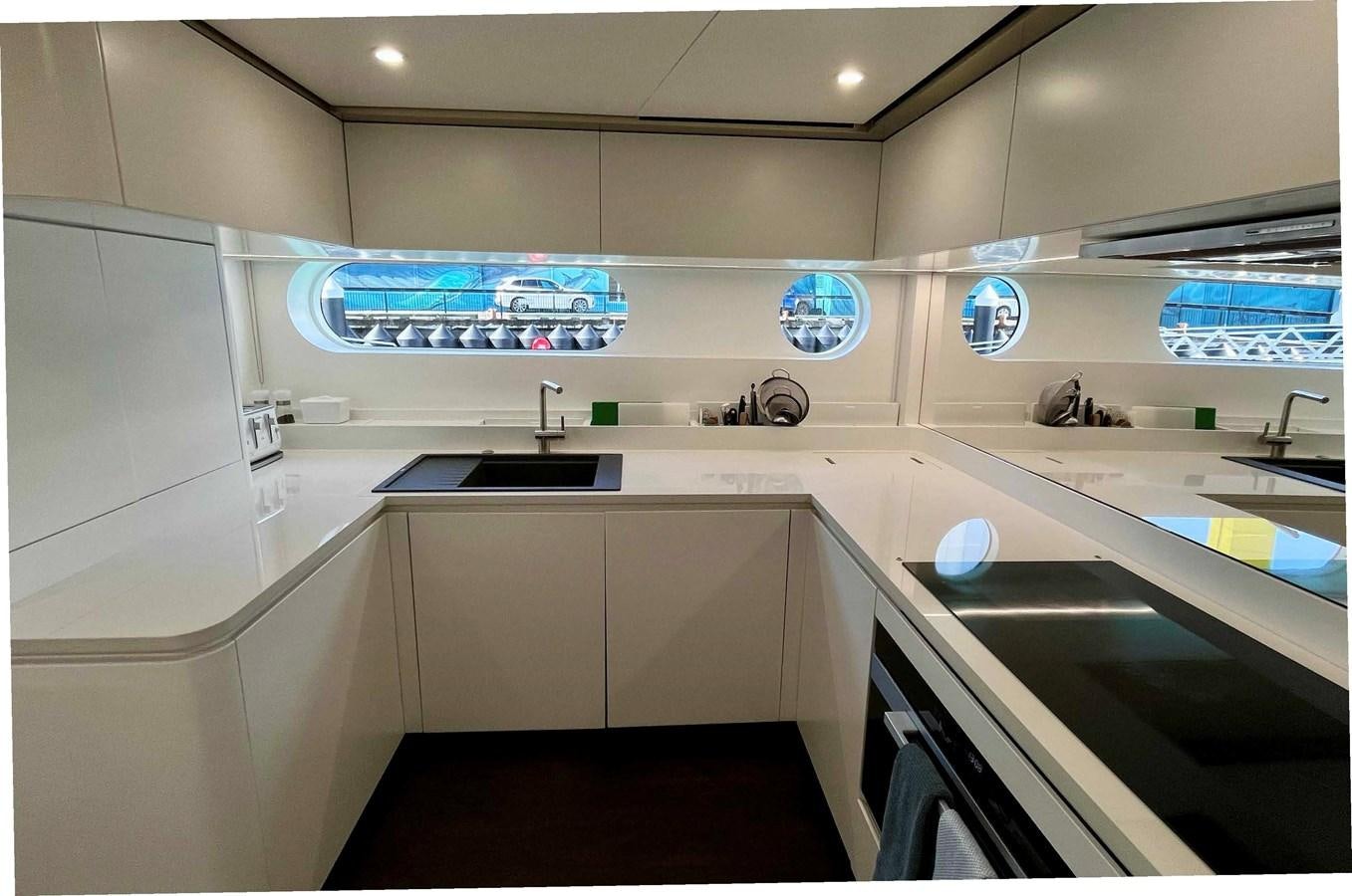 a kitchen with a large counter aboard DB Yacht for Sale