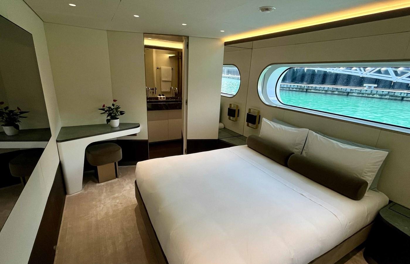 a room with a couch and a table aboard DB Yacht for Sale