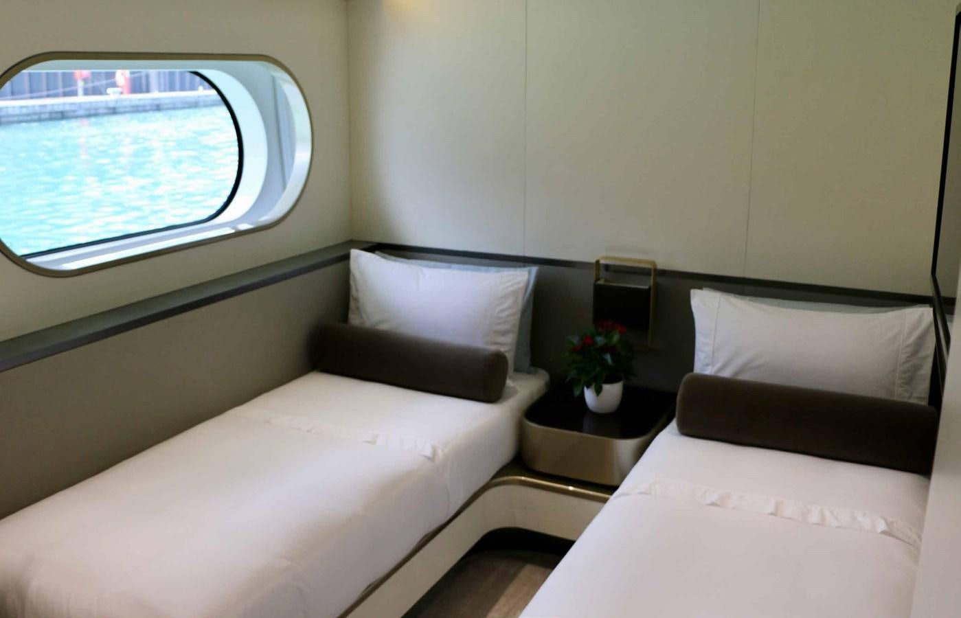 a couple of beds in a room aboard DB Yacht for Sale
