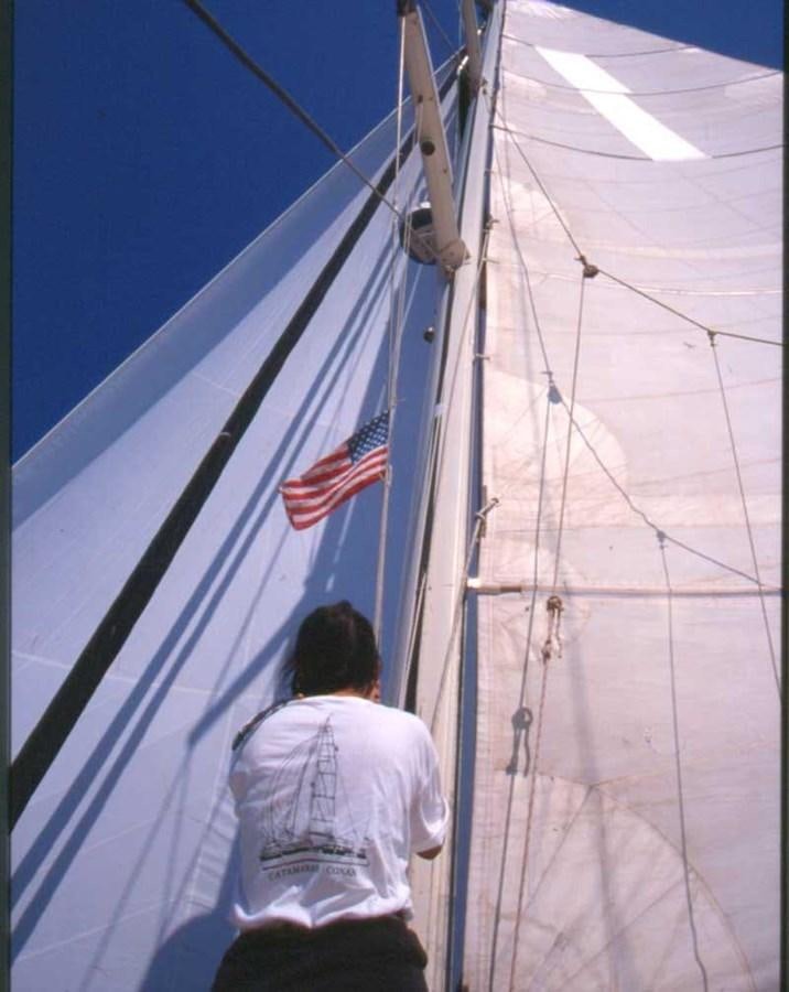 a person standing on a boat aboard CONAN Yacht for Sale