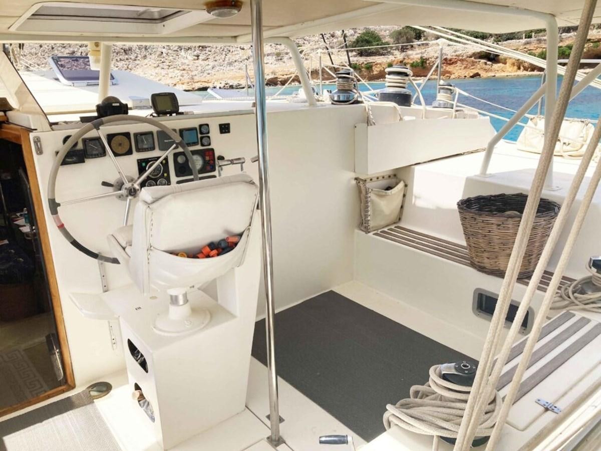 a white boat in a large body of water aboard CONAN Yacht for Sale