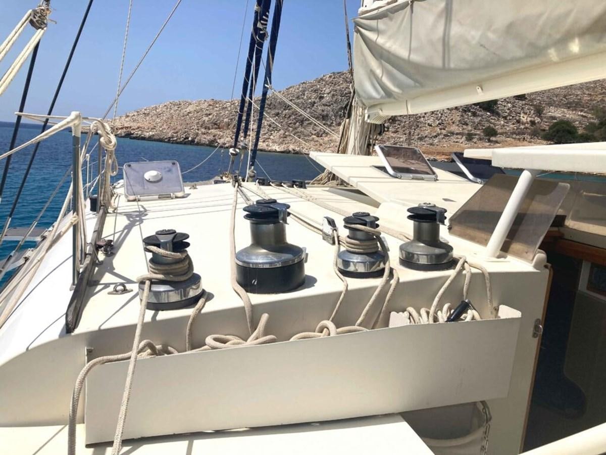 a boat with a large black object on it aboard CONAN Yacht for Sale
