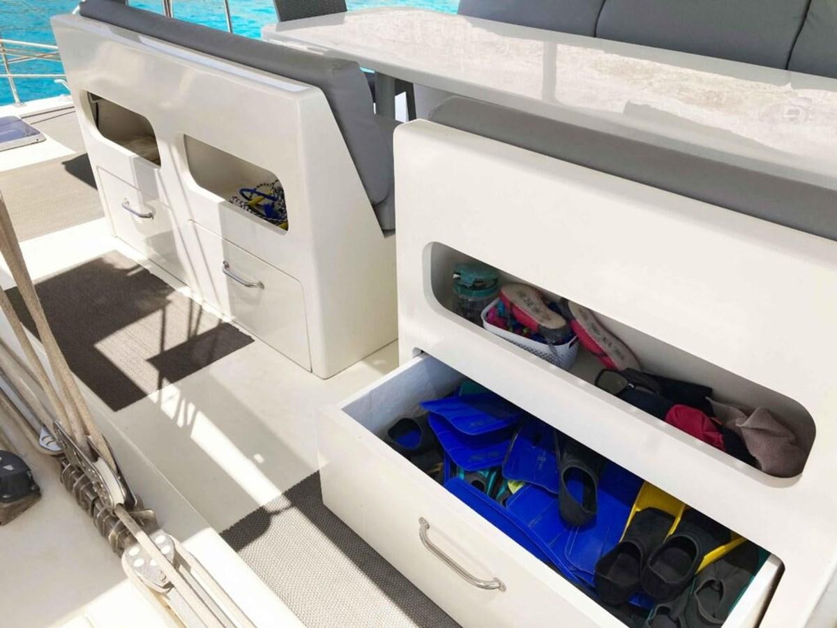 a white cabinet with a red door and a blue door with a white door and a black and aboard CONAN Yacht for Sale