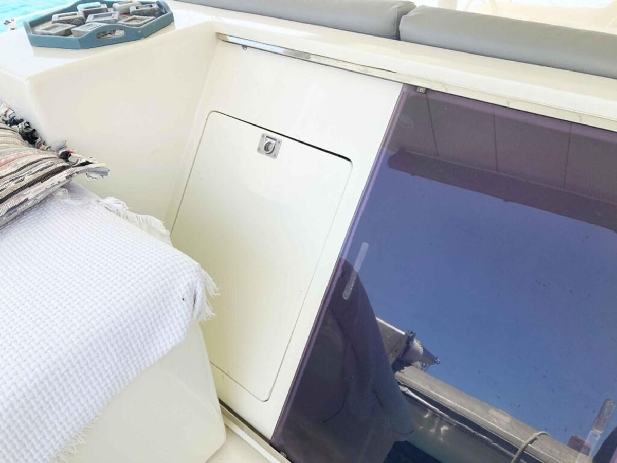 a white cabinet in a room aboard CONAN Yacht for Sale