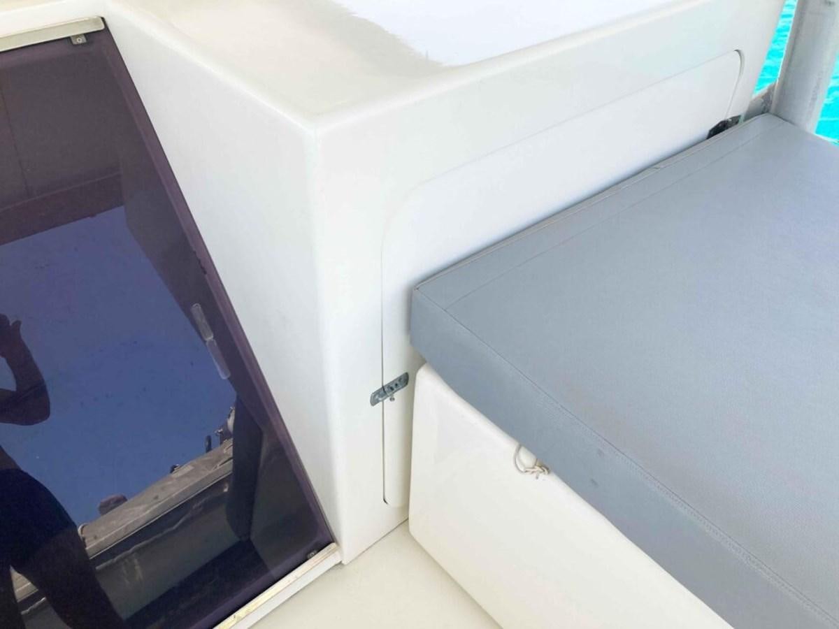 a white door with a handle aboard CONAN Yacht for Sale