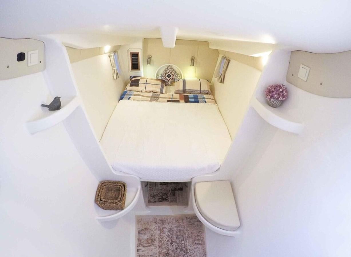 a bathroom with a tub and a sink aboard CONAN Yacht for Sale